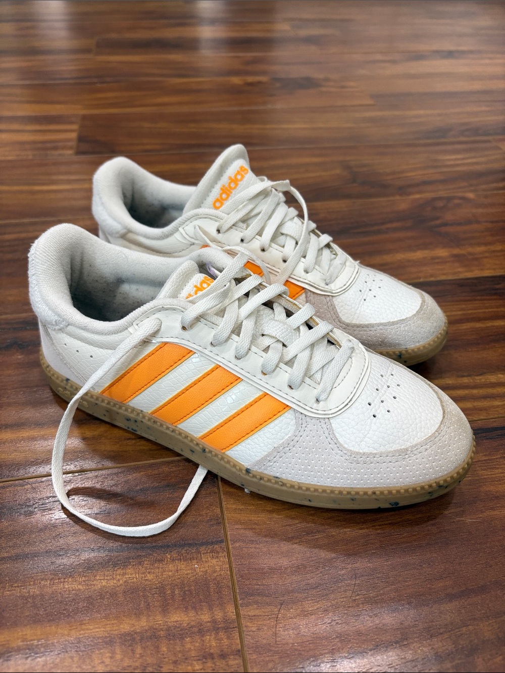 adidas Women’s White Sneakers with Orange Three-Stripes